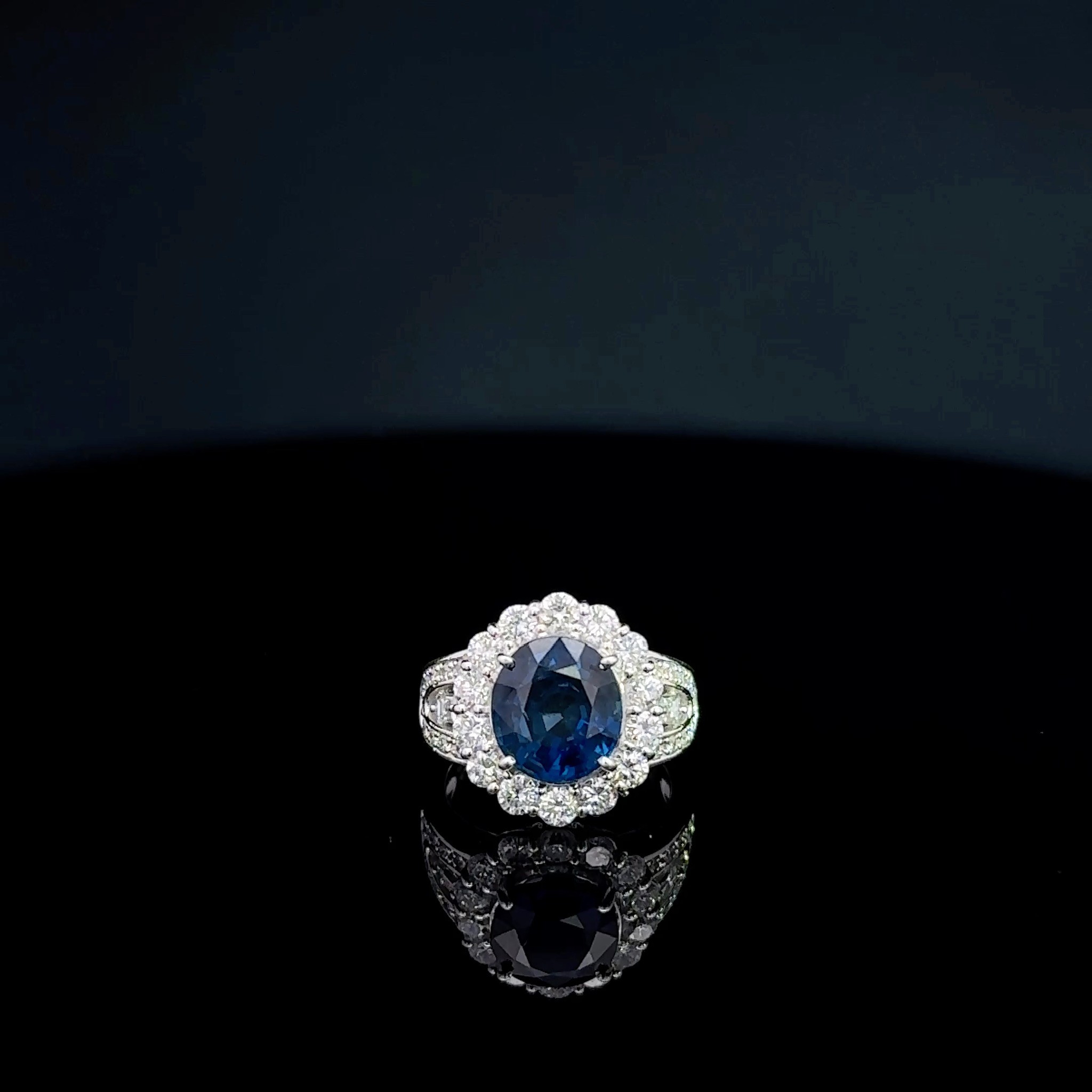 Single halo blue sapphire ring